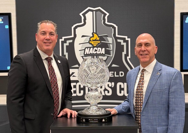 Director of Athletics Joe Jennum poses with the Learfield Directors' Cup, after Mt. SAC was named the nation's top community college athletics program for the second consecutive year.