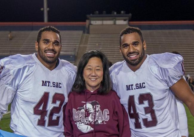 Suli (42) & Siti (43) Tamaivena with Dr. Audrey Yamagat-Noji at Bowl Game. Photo- David Aguilera