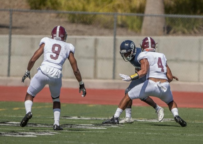 Max Latu and Charles Clayton take down Fullerton wide receiver.