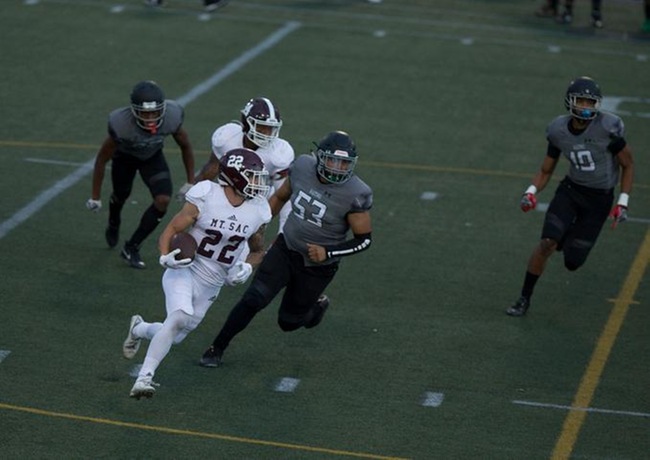 Mt. SAC Football vs ELAC - Jonathan Schofield running away from would be tacklers
