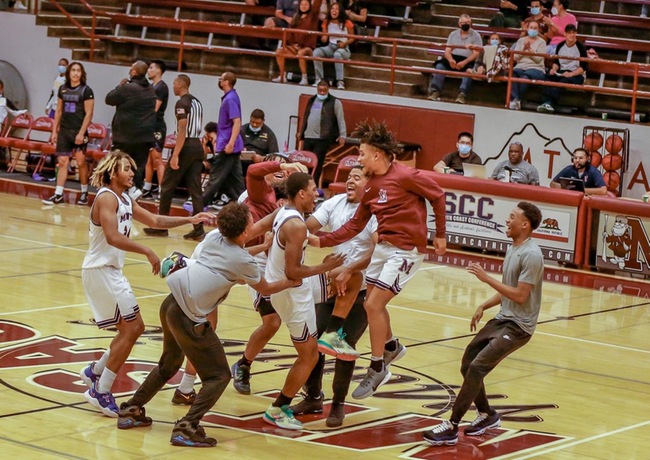 Mountie Men's Basketball celebrates at half court after last-second win