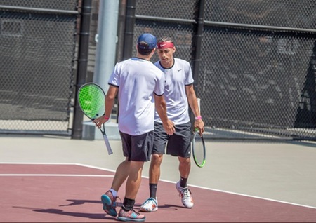 Mt. SAC Men's Tennis players shaking hands after a win