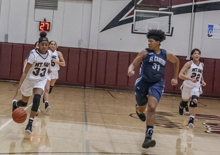 Mounties Lauryn Manns driving to the hole for 2 of her seven points