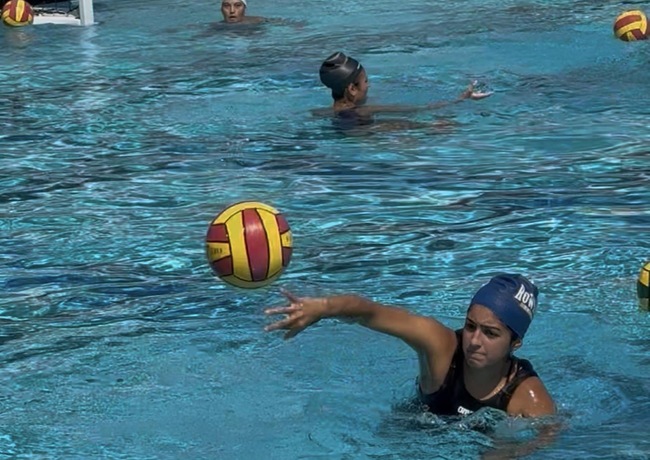 The Mt. SAC Women’s Water Polo team practices during preseason training at the campus Aquatics Center.