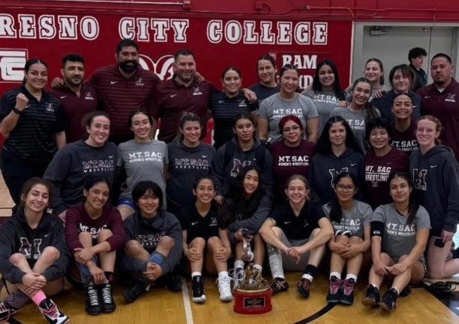 The Mt. SAC Women&rsquo;s Wrestling team poses with the championship trophy after defeating Cerritos College 29-20 to win the 3C2A State Dual Championship at Fresno City College.